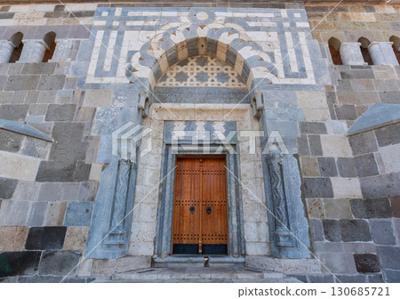 Alaeddin Mosque Main Entrance with Ornate Stone Work and Wooden Door, Konya, Turkey 130685721