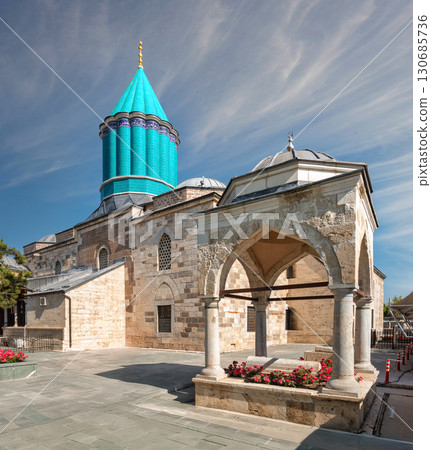 Mevlana Museum, aka Green Tomb, with its iconic turquoise dome under a blue sky in Konya, Turkey 130685736