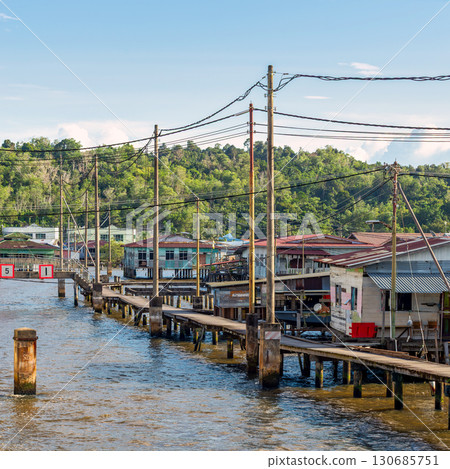 Kampong Ayer water village with traditional houses and wooden walkways in Bandar Seri Begawan, Brunei 130685751