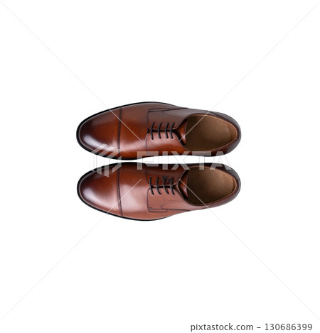 Brown leather shoes isolated on white background. 130686399