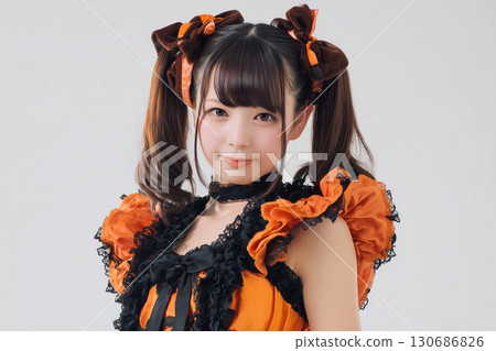 Portrait of a smiling young woman in a Halloween costume Portrait of a smiling young woman in a Halloween costume 130686826