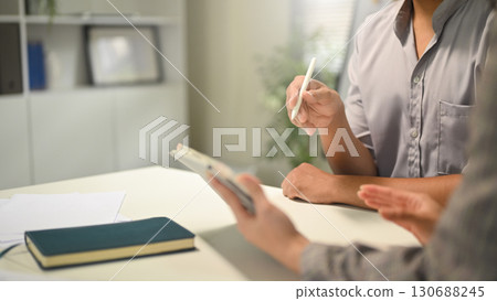 Close p of business professionals analyzing financial charts and graphs during a meeting Close p of business professionals analyzing financial charts and graphs during a meeting 130688245