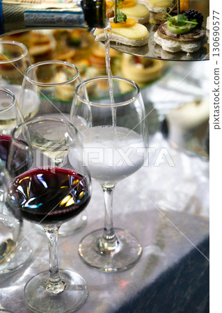 Pouring Champagne into Glass at Event Pouring Champagne into Glass at Event 130690577