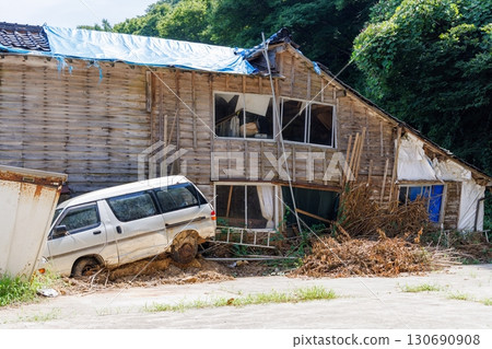 Damaged cars and houses swept away by the tsunami Damaged cars and houses swept away by the tsunami 130690908