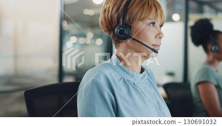 Business woman, consultant and call center for night communication, telemarketing research and online chat. Advisor or African person reading sales report, data analytics and planning in office bokeh 130691032