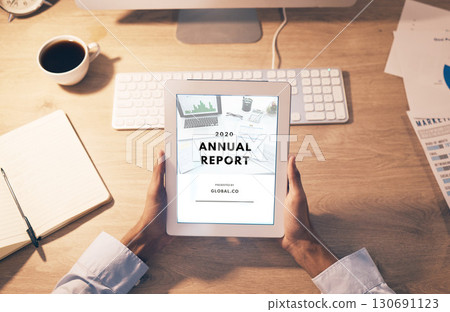 Hands, tablet and digital report above for business statistics or analytics of corporate data at office desk. Top view of employee manager hand holding touchscreen display of company information 130691123