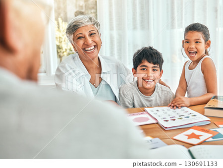 Happy, homework and grandmother sitting with her grandchildren helping them with fun activities. Happiness, smile and elderly woman spending time and bonding with kids outdoor of the family home. Happy, homework and grandmother sitting with her grandchildren helping them with fun activities. Happiness, smile and elderly woman spending time and bonding with kids outdoor of the family home. 130691133