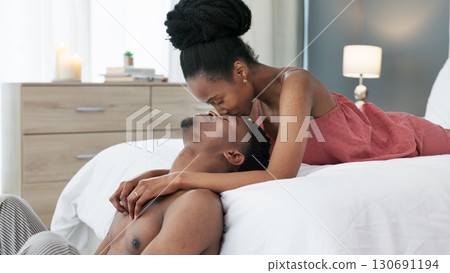 Forehead, morning or couple kiss in bedroom for bond, support or trust in a marriage commitment. Hug, love or African man with a woman, care or romance in a house, hotel or apartment together 130691194