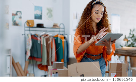 Fashion designer, woman and tablet with boxes for e commerce, stock management and logistics or online shop. Business owner or african entrepreneur with package inventory, digital and website order Fashion designer, woman and tablet with boxes for e commerce, stock management and logistics or online shop. Business owner or african entrepreneur with package inventory, digital and website order 130691546