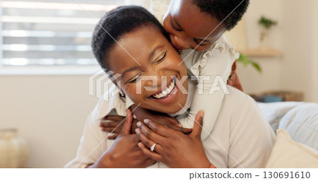 Mother and child, smile and hug on couch, playful and hug for trust, touch and face. Happy black family, home and crazy by comedy, fun and support or love, bonding and excited or quality time or care Mother and child, smile and hug on couch, playful and hug for trust, touch and face. Happy black family, home and crazy by comedy, fun and support or love, bonding and excited or quality time or care 130691610