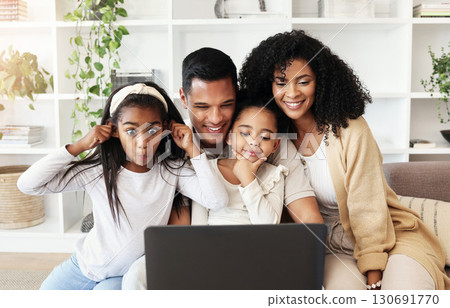 Video call, funny and family with a laptop for communication, movie or conversation online. Comic, bonding and parents with children for connection, photo or streaming on the internet with tech 130691770