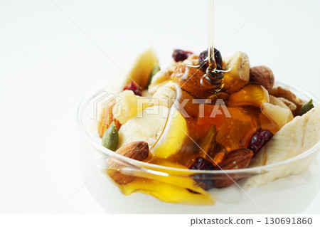 Greek yogurt with lots of ingredients and honey Greek yogurt with lots of ingredients and honey 130691860