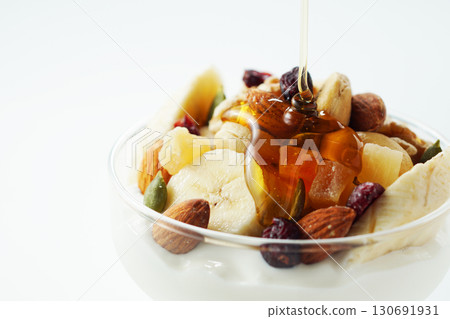 Greek yogurt with lots of ingredients and honey Greek yogurt with lots of ingredients and honey 130691931