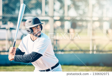 Sports, baseball and man in action with bat on field ready to hit ball in game, practice and competition. Fitness, motivation and male athlete outdoors for exercise, training and workout for match Sports, baseball and man in action with bat on field ready to hit ball in game, practice and competition. Fitness, motivation and male athlete outdoors for exercise, training and workout for match 130692071