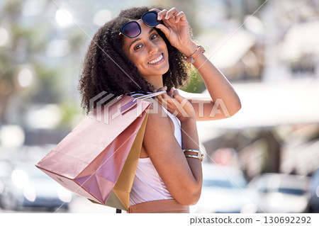 Shopping, black woman and portrait with bags at a mall, happy and excited for sale. Face, fashion and girl with relax with luxury, purchase while walking outdoors, satisfied and cheerful on weekend Shopping, black woman and portrait with bags at a mall, happy and excited for sale. Face, fashion and girl with relax with luxury, purchase while walking outdoors, satisfied and cheerful on weekend 130692292