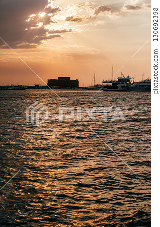 Paphos Castle reflecting on the sea at sunset in Cyprus Paphos Castle reflecting on the sea at sunset in Cyprus 130692398