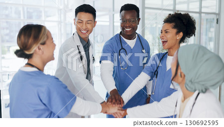 Healthcare, teamwork and hands together in hospital for support, collaboration or motivation. Doctors, nurses and diversity, medical employees in huddle for help and trust, men and women in medicine. 130692595