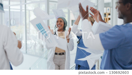 Doctors, team and throw paper in hospital for success, win and celebration with solidarity, support or diversity. Men, women and applause for confetti, goals and medical results with smile in clinic Doctors, team and throw paper in hospital for success, win and celebration with solidarity, support or diversity. Men, women and applause for confetti, goals and medical results with smile in clinic 130692603
