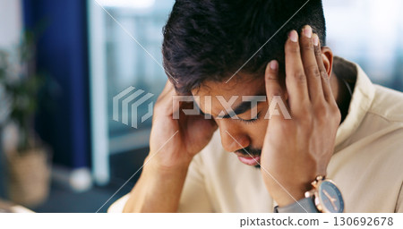 Headache, frustrated and tired business man or overworked employee in office. Stress, burnout and professional person with hand on head for fatigue with pain, crisis or fail and mistake at workplace 130692678