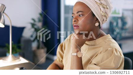 Thinking, business and black woman with ideas, planning and working on a digital proposal report. African person, employee and consultant in a workplace, copywriting and decision with inspiration 130692711