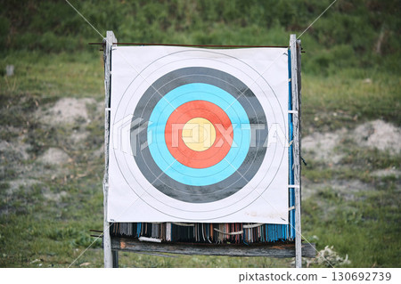 Bullseye target paper, outdoor and board at shooting range for weapon training, aim and accuracy. Sports, archery and poster for gun, bow and arrow at academy for police, army or security for goal Bullseye target paper, outdoor and board at shooting range for weapon training, aim and accuracy. Sports, archery and poster for gun, bow and arrow at academy for police, army or security for goal 130692739