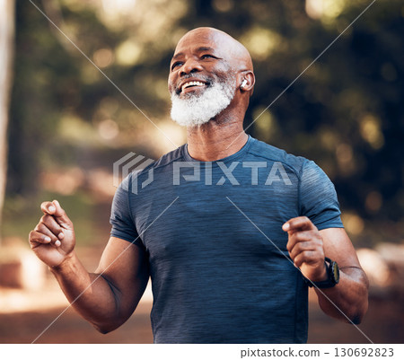 Park, success and running, winning black man excited and celebration at fitness run in nature with earphones. Music, workout and mature runner with smile and happy to celebrate exercise achievement. Park, success and running, winning black man excited and celebration at fitness run in nature with earphones. Music, workout and mature runner with smile and happy to celebrate exercise achievement. 130692823