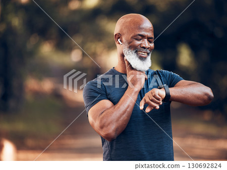 Fitness, black man and watch for pulse time and exercise while listening to music outdoor. Senior person with happy smartwatch for performance in forest with training workout for health and wellness Fitness, black man and watch for pulse time and exercise while listening to music outdoor. Senior person with happy smartwatch for performance in forest with training workout for health and wellness 130692824