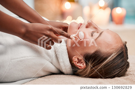 Face massage, roller and woman at spa with therapist, treatment and skincare, self care and rose quartz. Holistic therapy at luxury resort, healthy skin and wellness, hands and massaging with beauty Face massage, roller and woman at spa with therapist, treatment and skincare, self care and rose quartz. Holistic therapy at luxury resort, healthy skin and wellness, hands and massaging with beauty 130692829