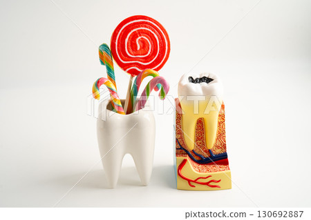 Sweet food and candy It cause tooth decay and root inflammation. 130692887