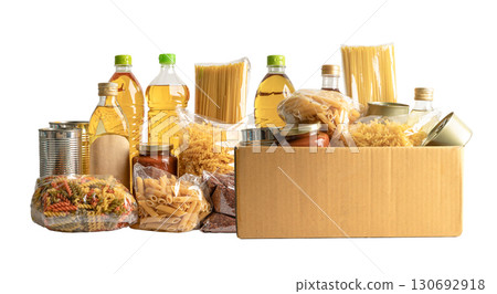 Foodstuff for donation, storage and delivery. Various food, pasta, cooking oil and canned food in cardboard box. 130692918