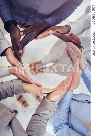 Hands, collaboration and workflow with a business team standing in a circle at the office from above. Meeting, partnership and teamwork with a group of people in a huddle for growth or synergy 130693004