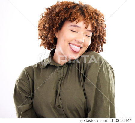 Face, tongue and afro with a playful black woman in studio isolated on a white background for fun or humor. Comic, playing or funny with an attractive young female feeling carefree or cheerful Face, tongue and afro with a playful black woman in studio isolated on a white background for fun or humor. Comic, playing or funny with an attractive young female feeling carefree or cheerful 130693144