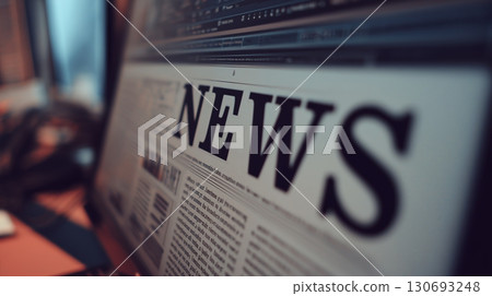 Close-up of computer screen displaying news article with bold headlines and text layout Close-up of computer screen displaying news article with bold headlines and text layout 130693248