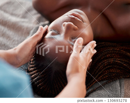 Black woman, face massage and masseuse hands with young female ready for facial. Skincare, spa beauty and wellness clinic with client feeling calm and zen before dermatology or cosmetic chemical peel 130693278