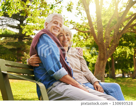 Old couple hug in portrait, relax in the park with smile, happiness together with bonding in nature, love and retirement. Happy, man and woman with travel, relationship with marriage and commitment Old couple hug in portrait, relax in the park with smile, happiness together with bonding in nature, love and retirement. Happy, man and woman with travel, relationship with marriage and commitment 130693528