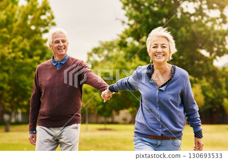 Old couple holding hands, outdoor in park and smile, happiness with freedom in nature, love and retirement. Happy, man and woman with travel, relationship with trust in marriage and commitment 130693533