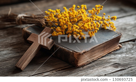 Cross and holy bible surrounded by beautiful yellow flowers for worship and prayer Cross and holy bible surrounded by beautiful yellow flowers for worship and prayer 130693725