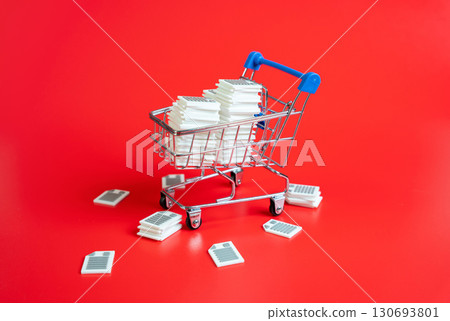 Shopping cart filled with documents and papers. Concept of excessive regulation, complex rules, and administrative barriers. Used for bureaucracy, tax policy, and compliance. Shopping cart filled with documents and papers. Concept of excessive regulation, complex rules, and administrative barriers. Used for bureaucracy, tax policy, and compliance. 130693801