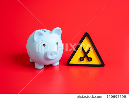 The budget is subject to cuts. Reduction of income and household savings. Concept of austerity, economic crisis, financial stress, and corporate downsizing. The budget is subject to cuts. Reduction of income and household savings. Concept of austerity, economic crisis, financial stress, and corporate downsizing. 130693806