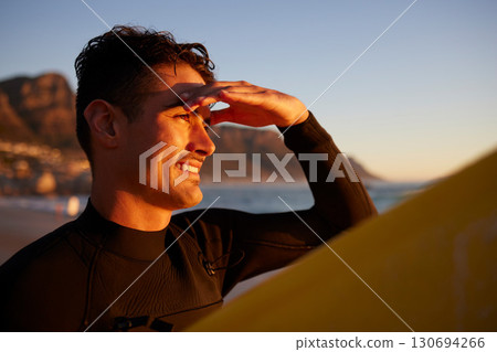 Sunset, surfer and man with view, fitness and happiness with summer vacation, workout and exercise. Male, athlete and happy guy with sunshine, beach or holiday on tropical island, wellness or freedom Sunset, surfer and man with view, fitness and happiness with summer vacation, workout and exercise. Male, athlete and happy guy with sunshine, beach or holiday on tropical island, wellness or freedom 130694266
