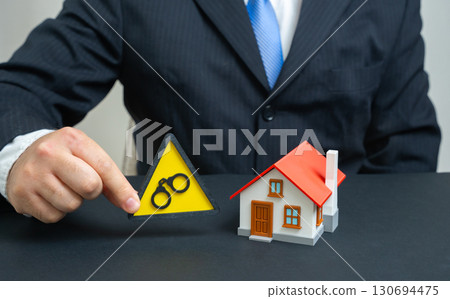 House under arrest. Freezing of an asset for purchase or sale until the end of the trial or entry into ownership rights, legal disputes, property conflicts, real estate litigation. House under arrest. Freezing of an asset for purchase or sale until the end of the trial or entry into ownership rights, legal disputes, property conflicts, real estate litigation. 130694475