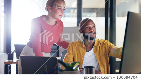 Training, black man and woman on computer to mentor, learning or planning a digital marketing, project or collaboration. Manager, teaching or helping employee in reading social media, SEO or research 130694704