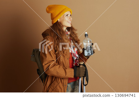Hiker with Backpack and Yellow Beanie 130694741