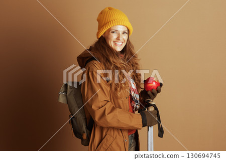 Prepared Woman Hiker with Apple and Backpack Prepared Woman Hiker with Apple and Backpack 130694745