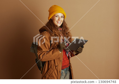 Woman Traveler with Tablet and Backpack 130694748
