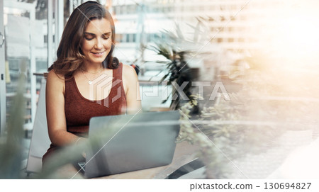 Woman, laptop and typing in coffee shop, cafe or restaurant for internet blogging, internet research or education course. Smile, happy and entrepreneur on technology with lens flare or freelance app Woman, laptop and typing in coffee shop, cafe or restaurant for internet blogging, internet research or education course. Smile, happy and entrepreneur on technology with lens flare or freelance app 130694827