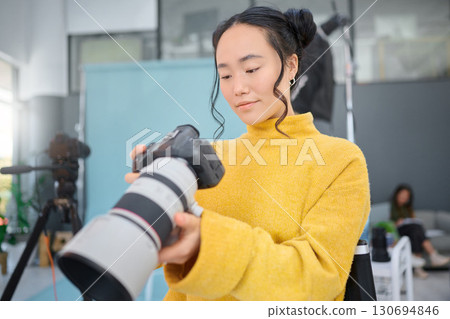 Photography camera, asian woman and digital agency worker review pictures in a studio. Photographer, production process and professional photoshoot with a creative employee checking catalog results Photography camera, asian woman and digital agency worker review pictures in a studio. Photographer, production process and professional photoshoot with a creative employee checking catalog results 130694846