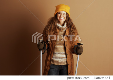Cheerful Woman Posing with Ski Poles 130694861