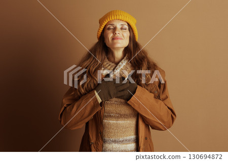 Peaceful Woman Reflecting in Autumn Attire 130694872