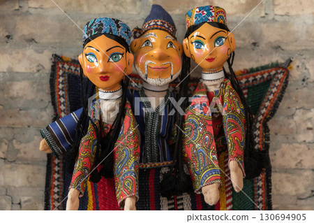 Handmade Uzbek hand puppets for sale are in tourist shop in old town of Bukhara Handmade Uzbek hand puppets for sale are in tourist shop in old town of Bukhara 130694905